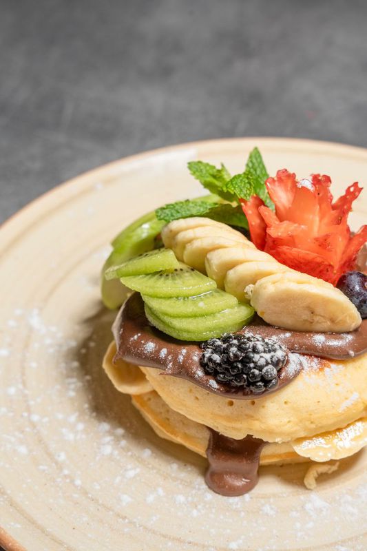 Pancakes with fruits of the day and Nutella